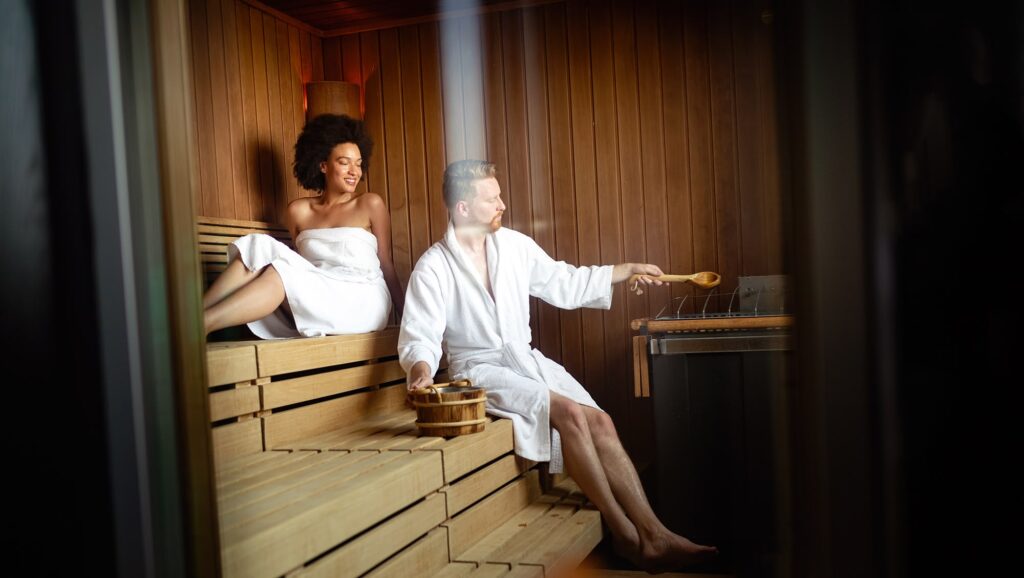 beautiful-young-couple-sitting-together-in-a-sauna-2023-11-27-05-30-44-utc.jpg